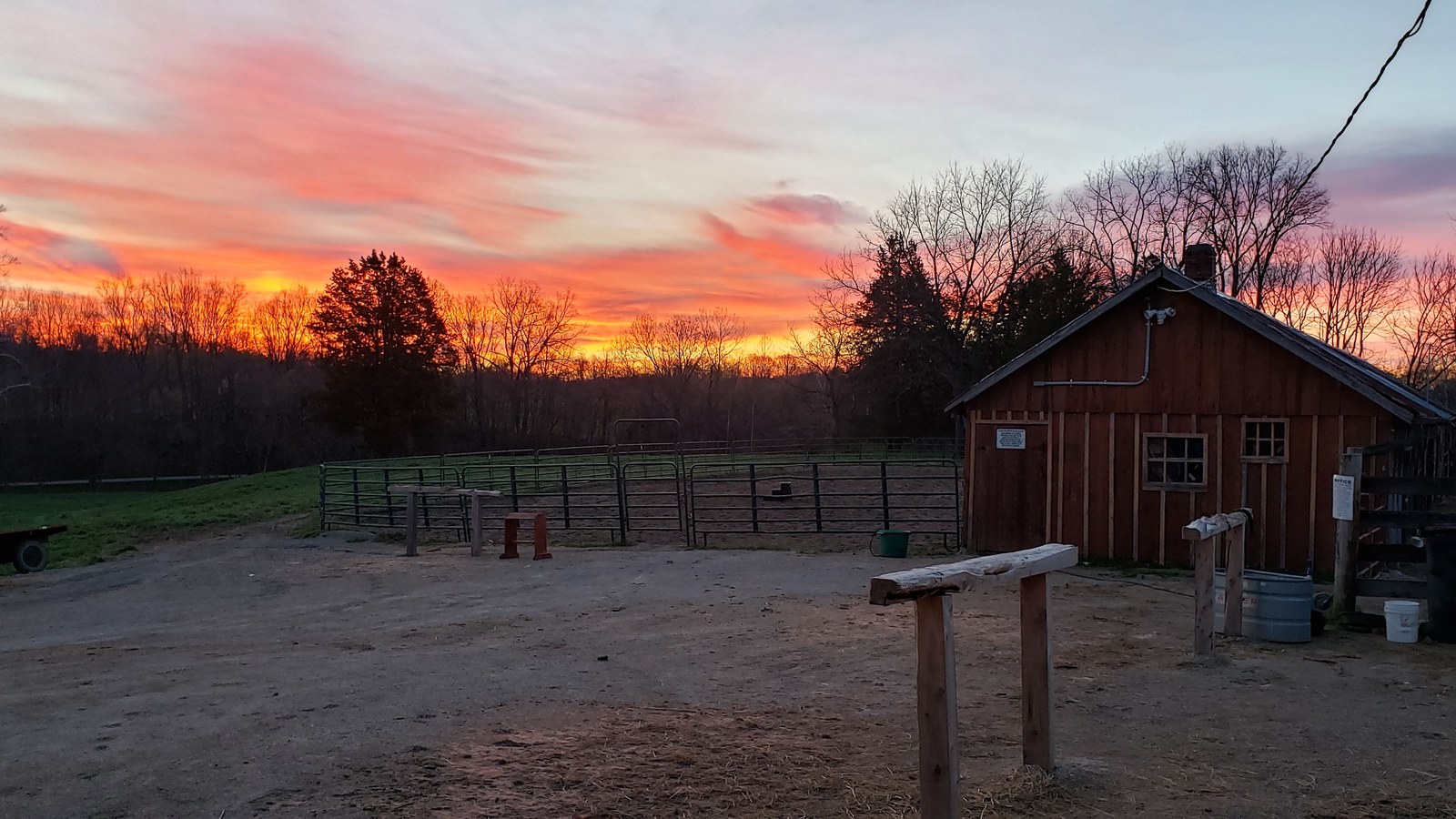 Sunset on the farm with barn and round pen at BV Farms in Defiance, Missouri