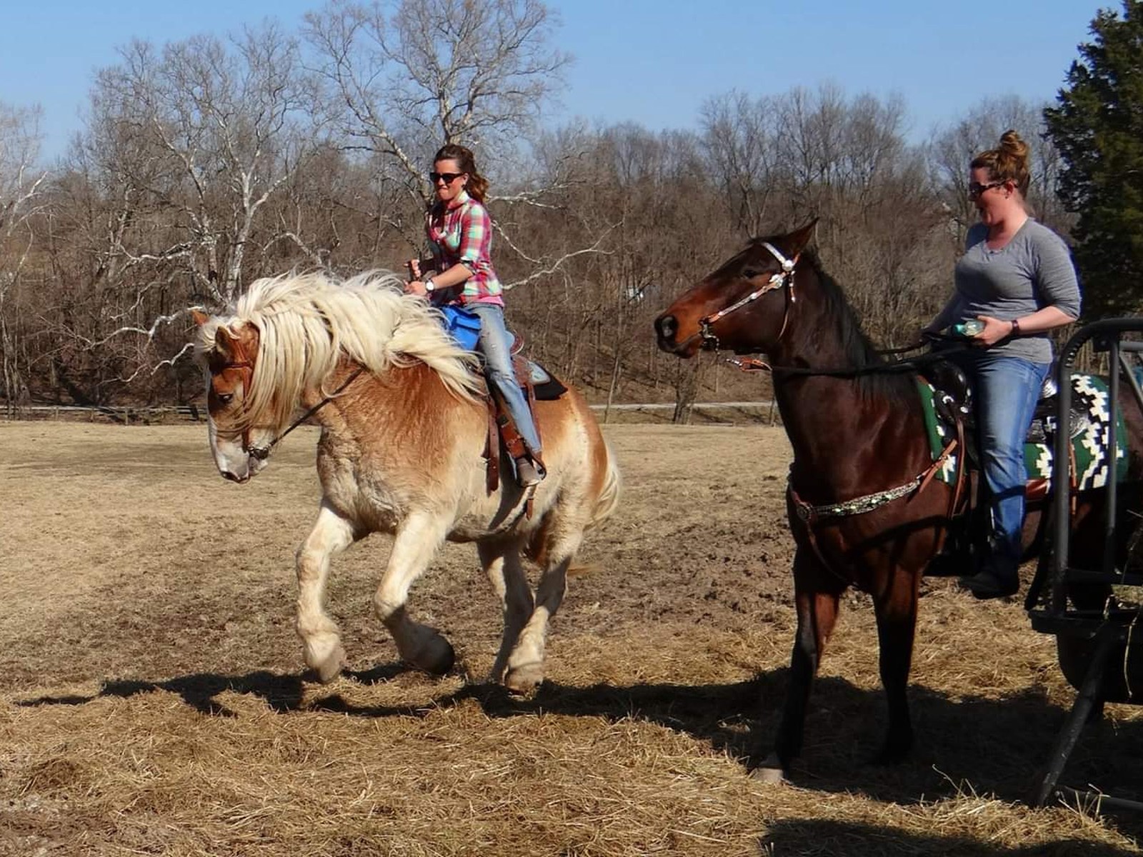 Two riders on horseback trail riding at BV Farms in Defiance, Missouri